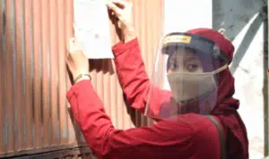 Pemasangan poster tentang Standar Operasional Prosedur menuju New Normal